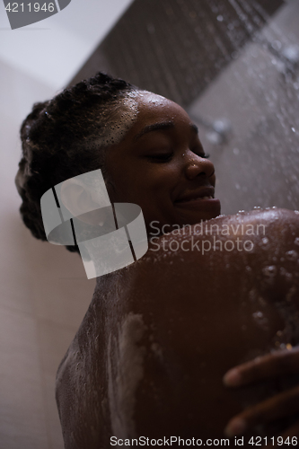 Image of African American woman in the shower