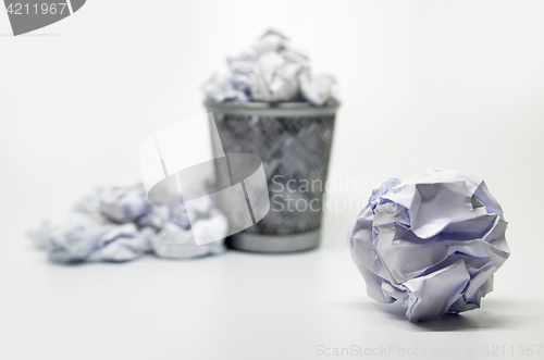 Image of Garbage bin with paper waste