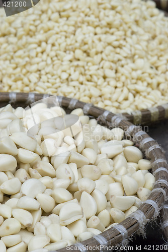 Image of Peeled garlic at a market