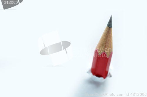 Image of Red pencil and white torn paper