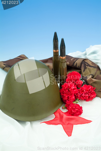 Image of Flowers And Army Equipment