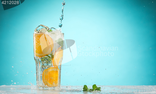 Image of The rose exotic cocktail and fruit on blue