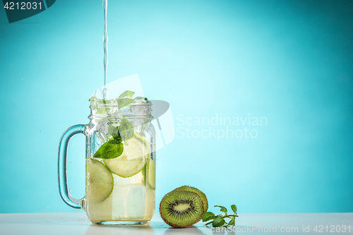 Image of The rose exotic cocktail and fruit on blue