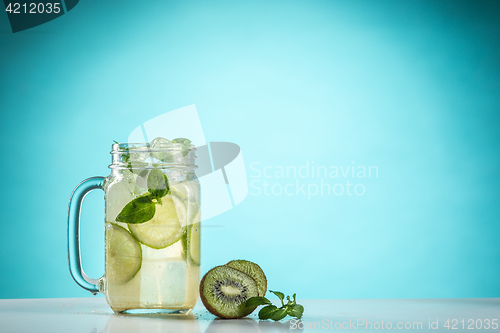 Image of The rose exotic cocktail and fruit on blue