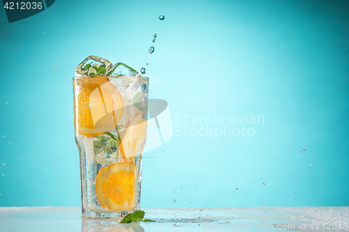 Image of The rose exotic cocktail and fruit on blue