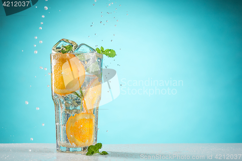 Image of The rose exotic cocktail and fruit on blue