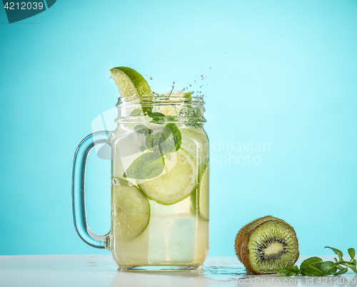 Image of The rose exotic cocktail and fruit on blue