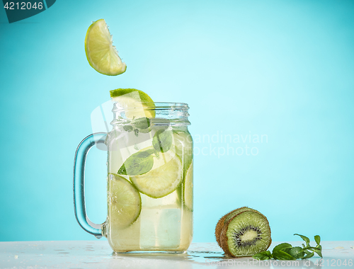 Image of The rose exotic cocktail and fruit on blue