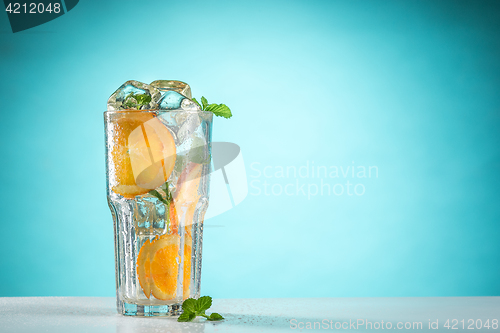 Image of The rose exotic cocktail and fruit on blue