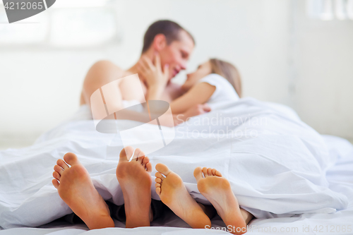 Image of Lifestyle. Beautiful couple in bed