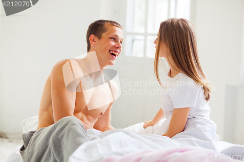 Image of Lifestyle. Beautiful couple in bed