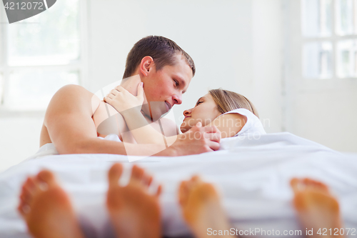 Image of Lifestyle. Beautiful couple in bed