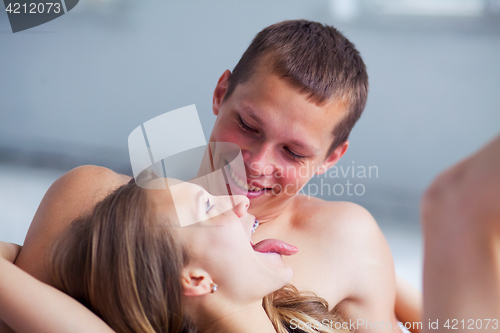 Image of Lifestyle. Beautiful couple in bed