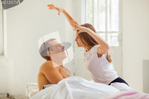 Image of Lifestyle. Beautiful couple in bed