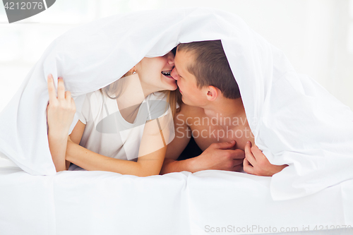 Image of Lifestyle. Beautiful couple in bed