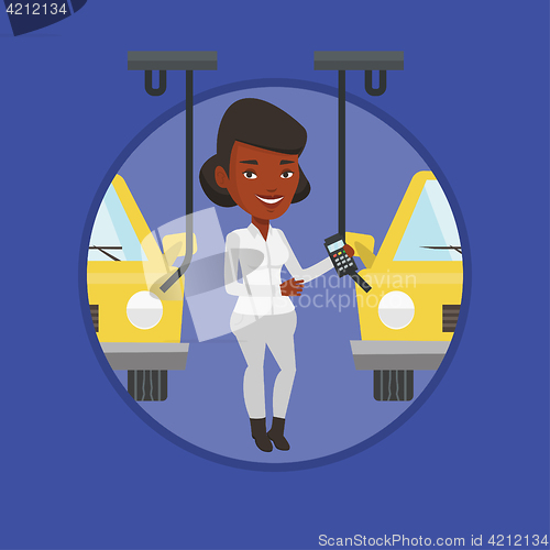 Image of Worker controlling automated assembly line for car