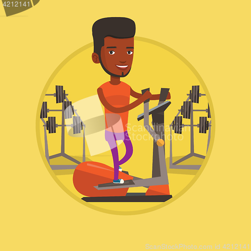 Image of Man exercising on elliptical trainer.