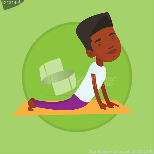 Image of Man practicing yoga upward dog pose.