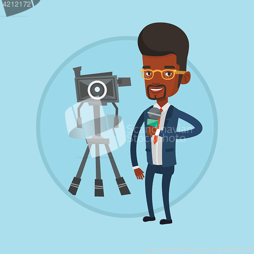 Image of TV reporter with microphone and camera.