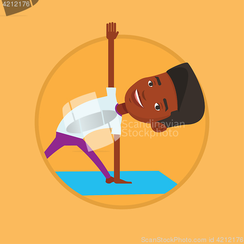 Image of Man practicing yoga triangle pose.