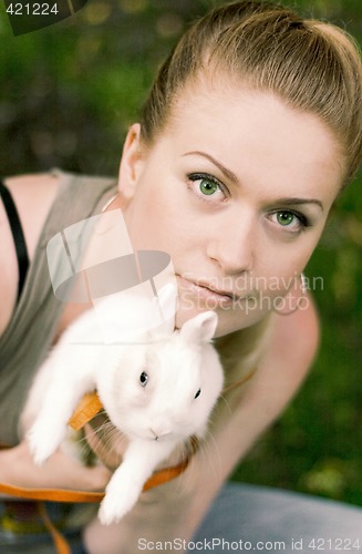 Image of girl with her white rabbit