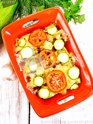 Image of Casserole from minced meat and zucchini in brazier on board top