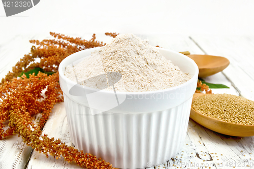 Image of Flour amaranth in white bowl with spoon on board