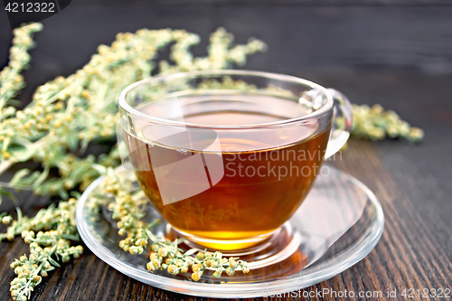 Image of Tea with wormwood in glass cup on table