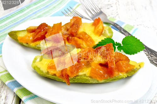 Image of Courgettes in spicy sauce on board