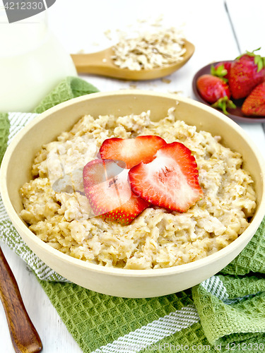 Image of Oatmeal with strawberries on napkin