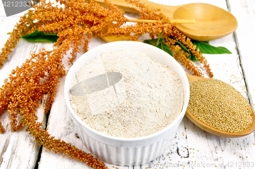 Image of Flour amaranth in white bowl with spoon on light board