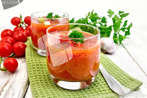 Image of Soup tomato in two glasses on light board