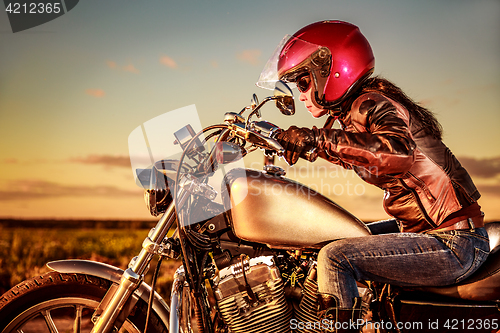 Image of Biker girl on a motorcycle