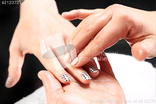 Image of Manicure, hand massage. Massage hand care treatment at the beauty salon. 