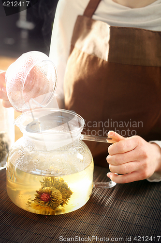 Image of Blooming tea brewed in a glass jug.