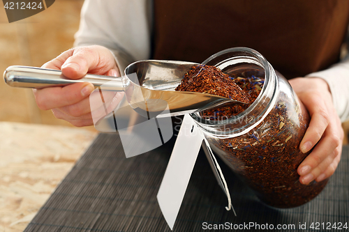 Image of Tea room, a woman buys fruit tea