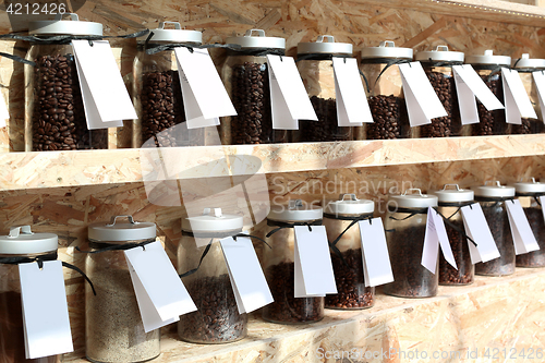 Image of Coffee roaster Shelf with jars of coffee beans 