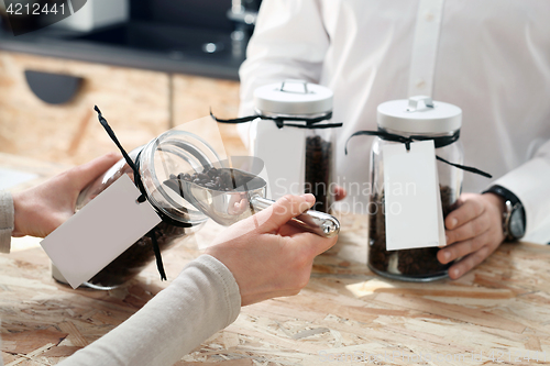 Image of Coffee on the scale, coffee shop A woman buys a cup of coffee in the coffee shop