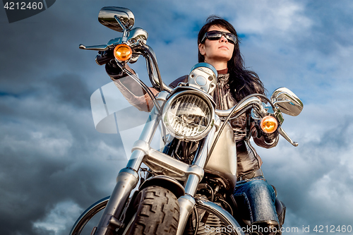 Image of Biker girl on a motorcycle