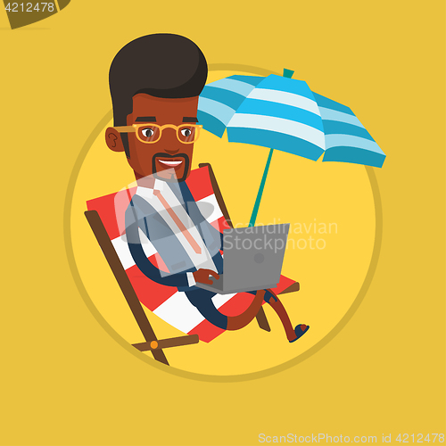Image of Businessman working on laptop on the beach.