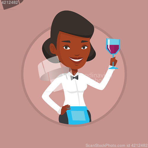 Image of Bartender holding a glass of wine in hand.