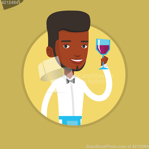 Image of Bartender holding a glass of wine in hand.