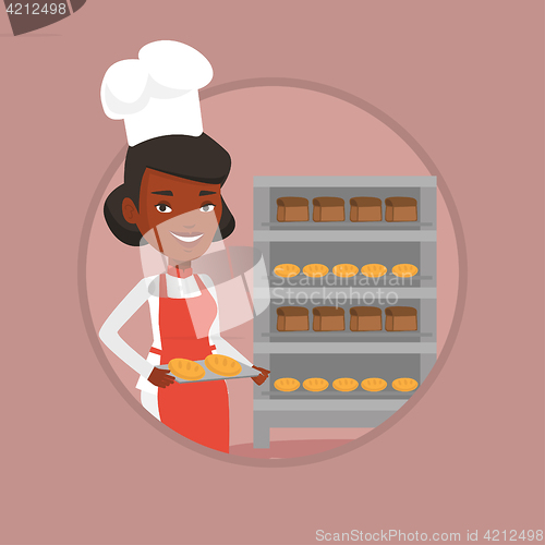 Image of Happy young female baker holding tray of bread.