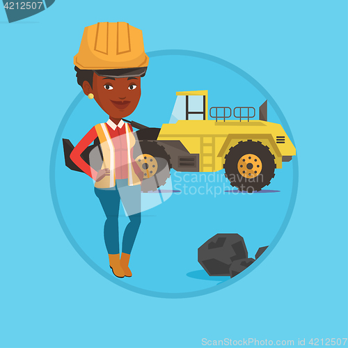 Image of Miner with a big excavator on background.