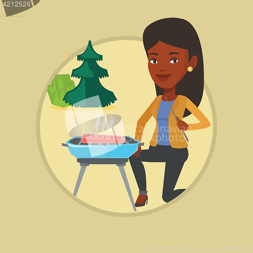 Image of Woman cooking steak on barbecue grill.