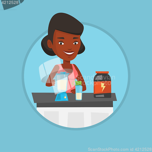 Image of Young woman making protein cocktail.