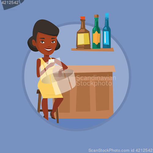 Image of Woman sitting at the bar counter.