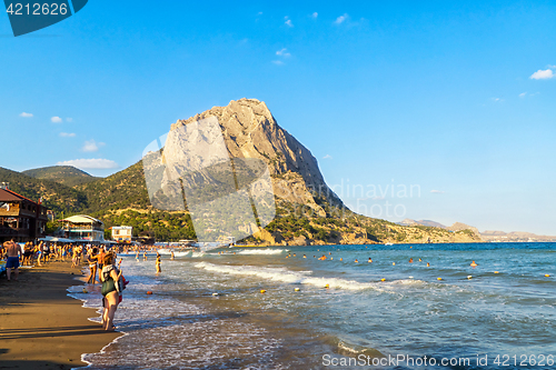 Image of Vacationers on sea beach in Crimea