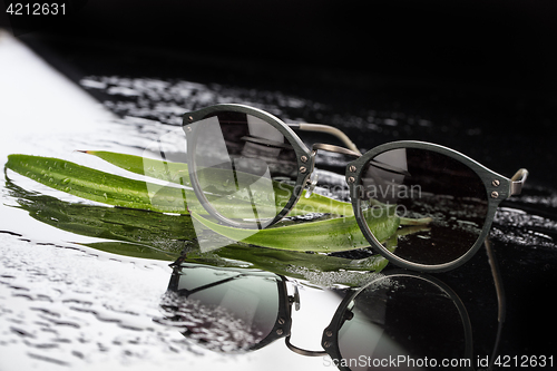 Image of Sunglasses On Glass