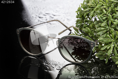 Image of Sunglasses On Glass